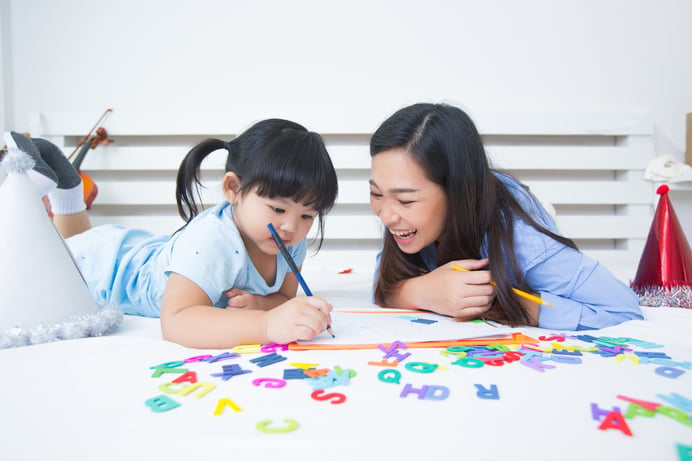 mother-daughter-studying-alphabet