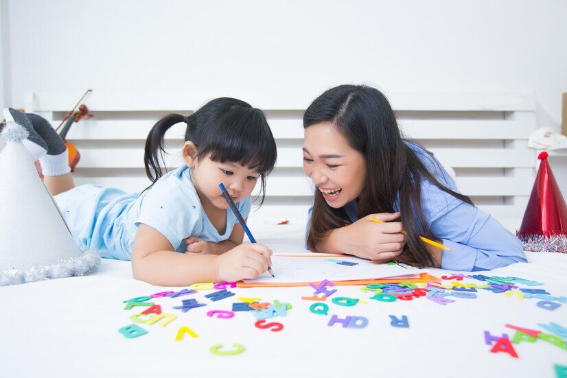 mother-daughter-studying-alphabet_1150-17765